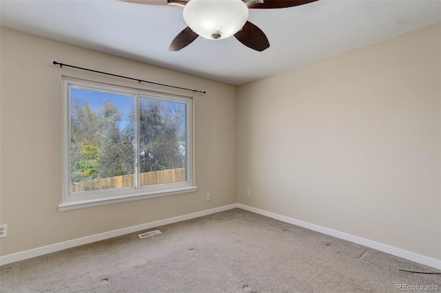 empty room featuring carpet and ceiling fan