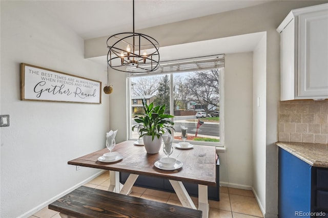 646 S Joplin St, Aurora, CO 80017 - dining room with plenty of natural light, light tile patterned floors, and a chandelier
