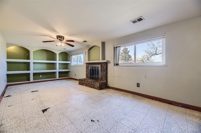 unfurnished living room featuring visible vents, a fireplace, baseboards, and tile patterned floors