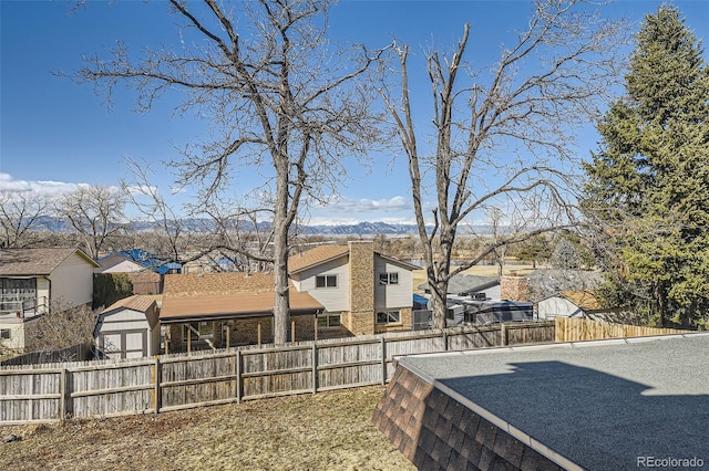 view of yard featuring fence private yard and a residential view