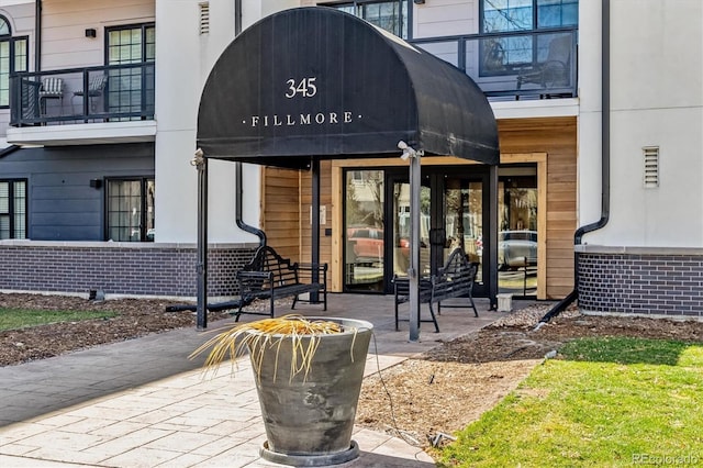 entrance to property with brick siding