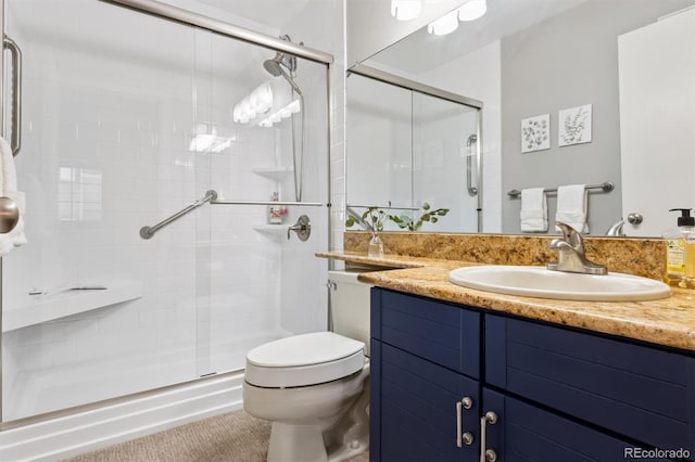 full bath featuring a stall shower, toilet, and vanity