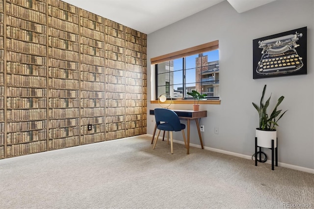 carpeted office featuring baseboards