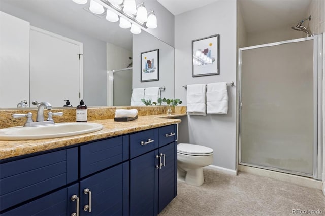 full bathroom with toilet, a stall shower, and vanity