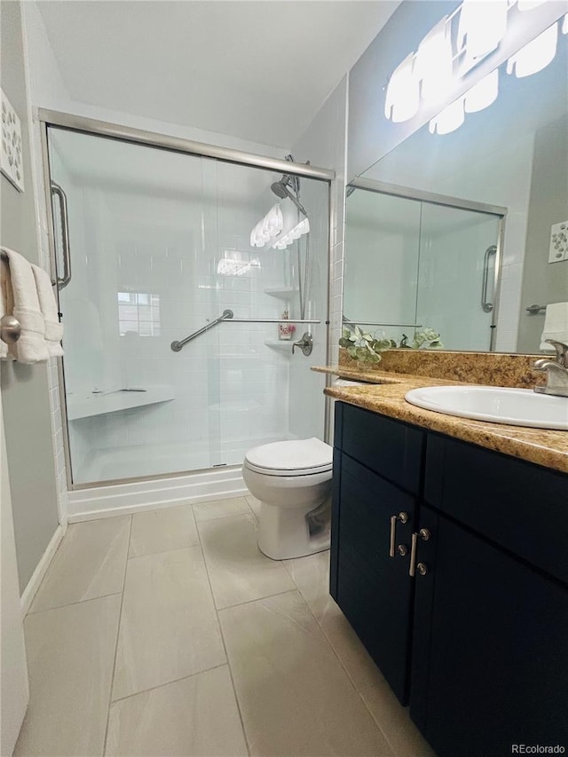 345 Fillmore St Unit 203, Denver, CO 80206 - bathroom with toilet, vanity, and a shower stall
