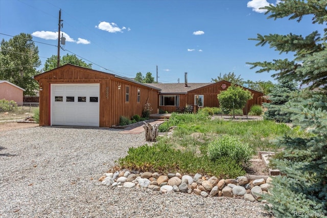 225 Shavano St, Poncha Springs, CO 81242 - ranch-style house with gravel driveway and board and batten siding