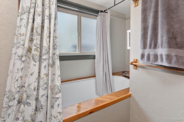 225 Shavano St, Poncha Springs, CO 81242 - full bathroom featuring shower / bathtub combination with curtain and a textured wall