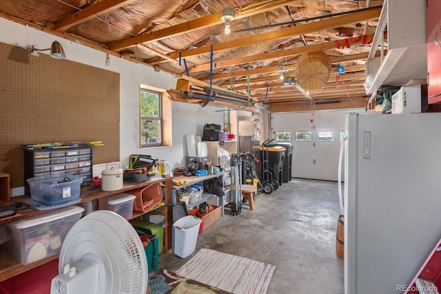 225 Shavano St, Poncha Springs, CO 81242 - miscellaneous room with unfinished concrete flooring, healthy amount of natural light, and a garage