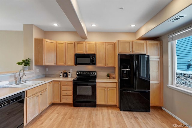 2763 W Riverwalk Cir Unit B, Littleton, CO 80123 - kitchen with black appliances, light brown cabinets, a sink, light wood-style flooring, and recessed lighting