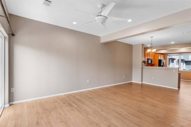 2763 W Riverwalk Cir Unit B, Littleton, CO 80123 - unfurnished living room with light wood-style floors, a chandelier, recessed lighting, baseboards, and a ceiling fan