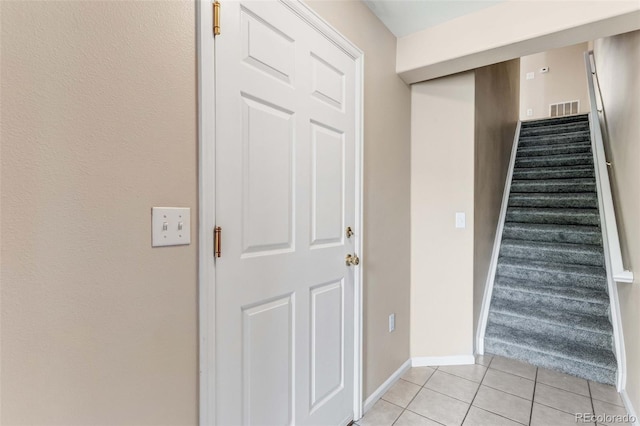 2763 W Riverwalk Cir Unit B, Littleton, CO 80123 - staircase with tile patterned floors and baseboards