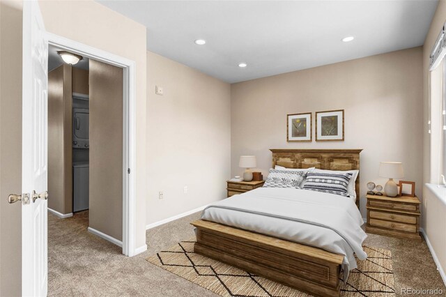 2763 W Riverwalk Cir Unit B, Littleton, CO 80123 - bedroom featuring light colored carpet, recessed lighting, and baseboards