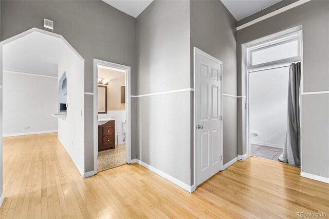 corridor featuring light hardwood / wood-style flooring