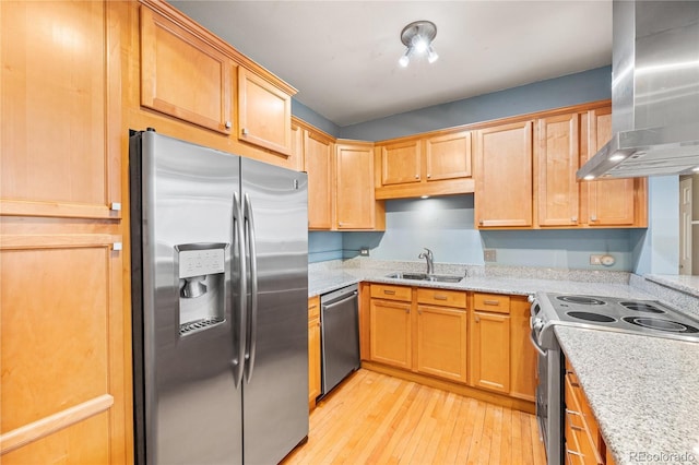 kitchen featuring appliances with stainless steel finishes, island exhaust hood, a sink, and light stone countertops