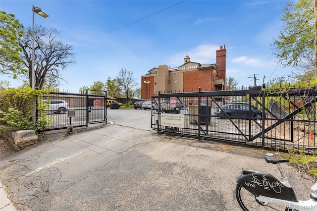 view of gate with fence