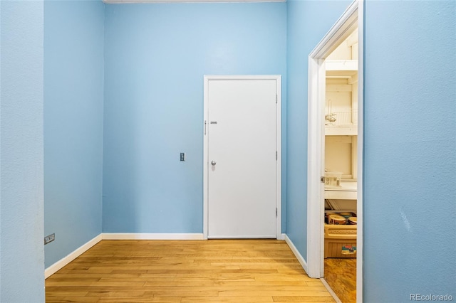 interior space featuring light wood-style floors and baseboards