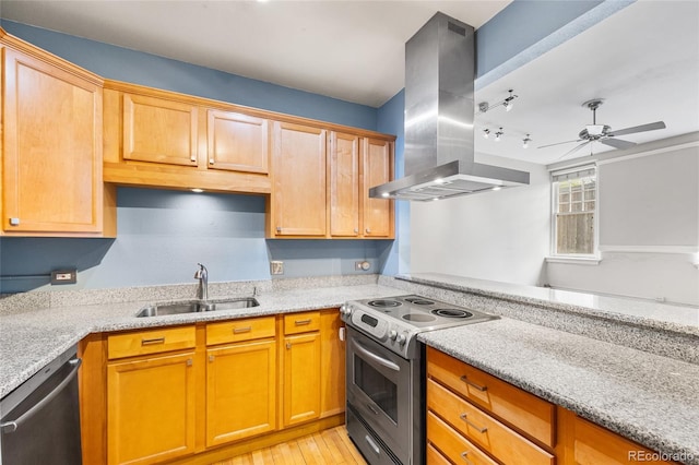 kitchen featuring stainless steel appliances, light stone counters, a sink, and island range hood