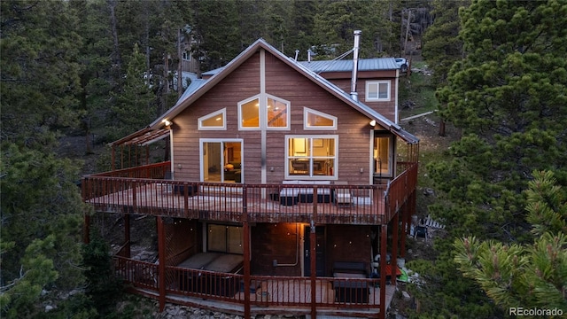 302 Texas Dr, Idaho Springs, CO 80452 - view of front facade with a deck and a view of trees