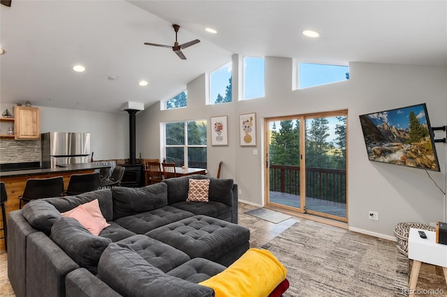 302 Texas Dr, Idaho Springs, CO 80452 - living room featuring a wood stove, ceiling fan, recessed lighting, and high vaulted ceiling
