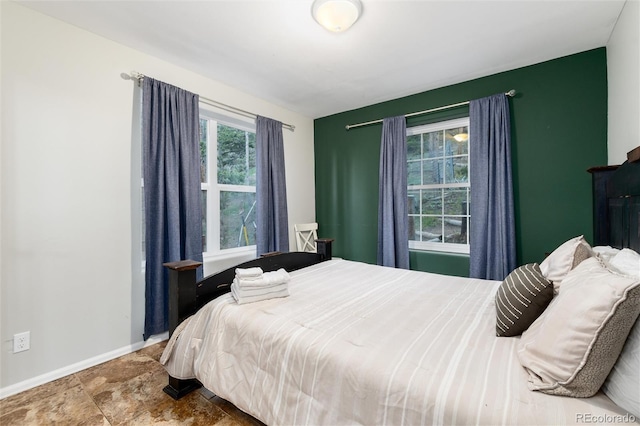 302 Texas Dr, Idaho Springs, CO 80452 - bedroom featuring baseboards and stone finish flooring