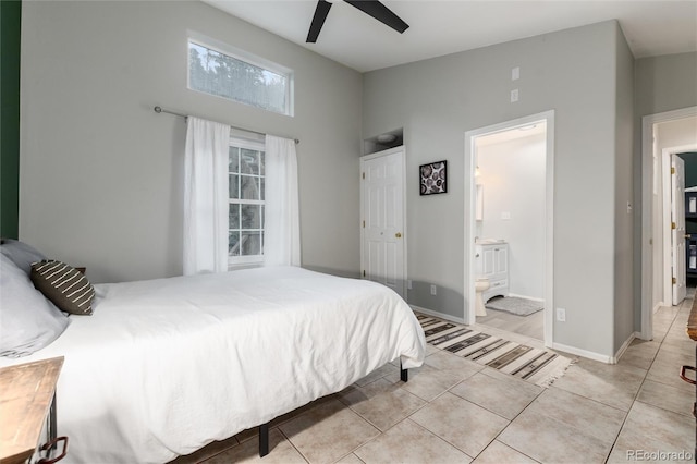 302 Texas Dr, Idaho Springs, CO 80452 - bedroom with light tile patterned floors, ensuite bathroom, and ceiling fan
