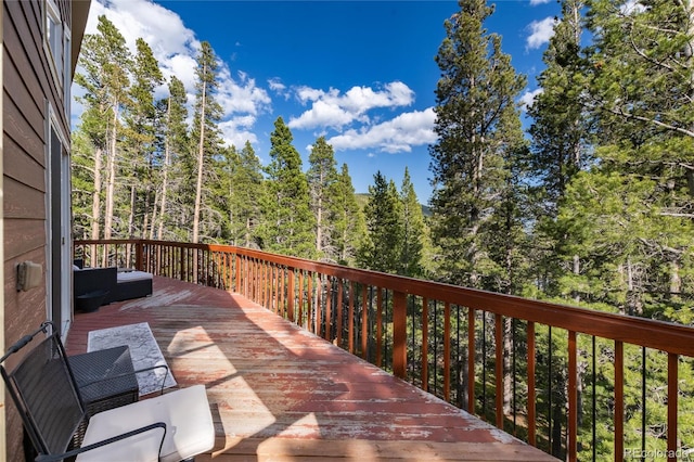 302 Texas Dr, Idaho Springs, CO 80452 - wooden terrace with a wooded view