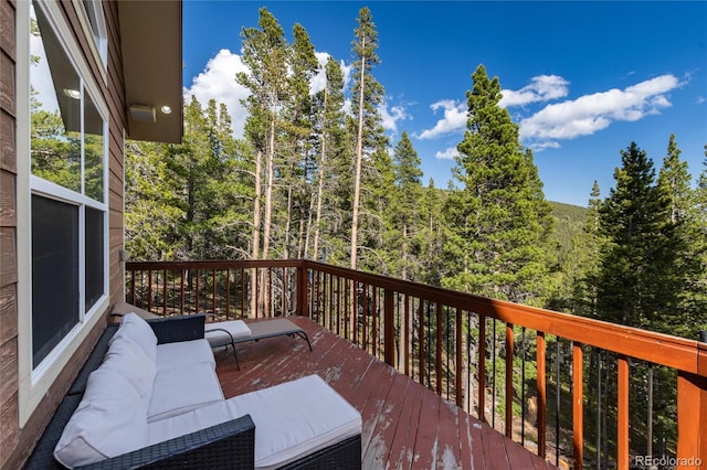 302 Texas Dr, Idaho Springs, CO 80452 - wooden deck with an outdoor hangout area and a forest view
