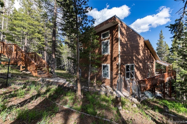 302 Texas Dr, Idaho Springs, CO 80452 - view of side of home with stairway and a wooden deck