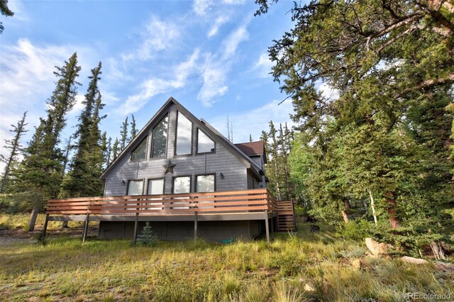 rear view of house with a deck