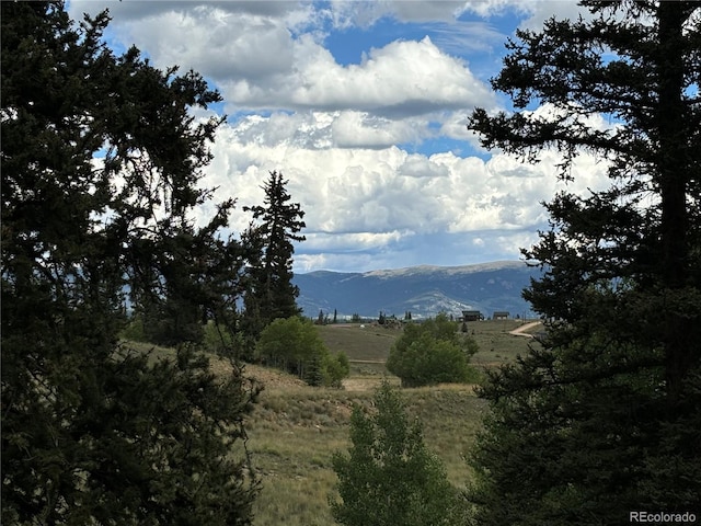 mountain view featuring a rural view