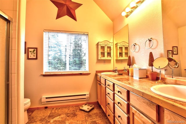 full bathroom featuring double vanity, a baseboard radiator, lofted ceiling, a shower with shower door, and a sink