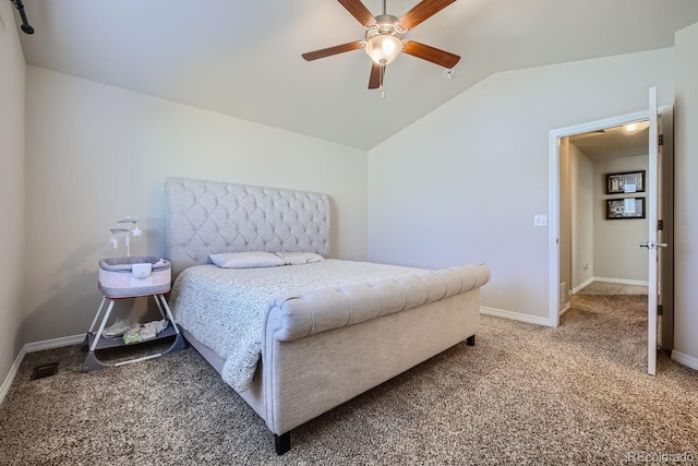 carpeted bedroom with vaulted ceiling and ceiling fan