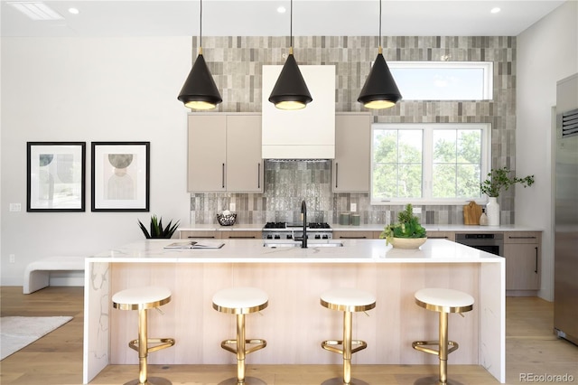 5070 Easley Rd, Golden, CO 80403 - kitchen with backsplash, light countertops, hanging light fixtures, a center island with sink, and recessed lighting