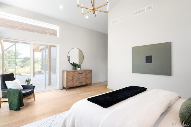 5070 Easley Rd, Golden, CO 80403 - bedroom featuring high vaulted ceiling, wood finished floors, access to outside, a chandelier, and recessed lighting
