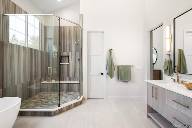 5070 Easley Rd, Golden, CO 80403 - bathroom featuring vanity, a shower stall, a soaking tub, and tile patterned floors