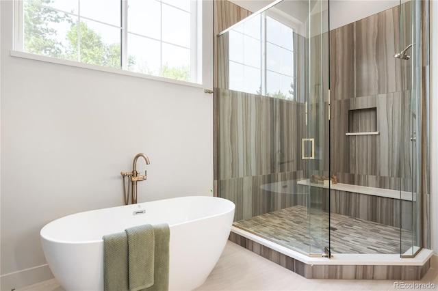5070 Easley Rd, Golden, CO 80403 - full bathroom with a freestanding tub, a shower stall, and healthy amount of natural light