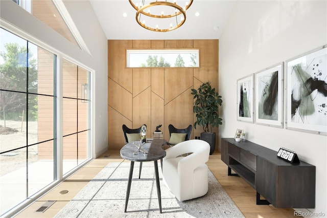 5070 Easley Rd, Golden, CO 80403 - sitting room with high vaulted ceiling, a chandelier, and light wood-style floors