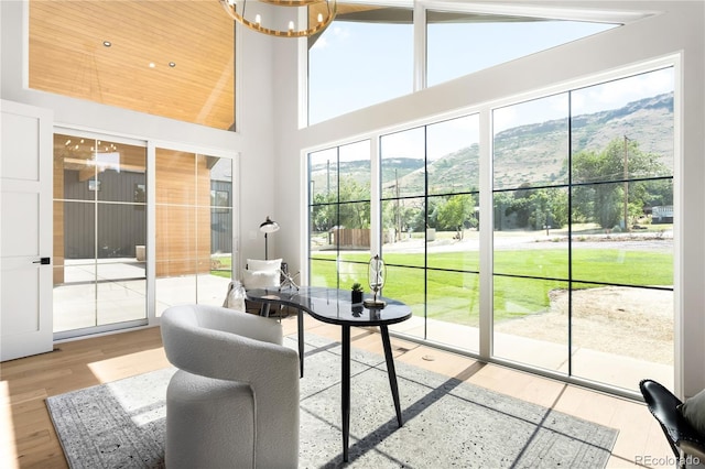 5070 Easley Rd, Golden, CO 80403 - sunroom featuring a chandelier and a mountain view