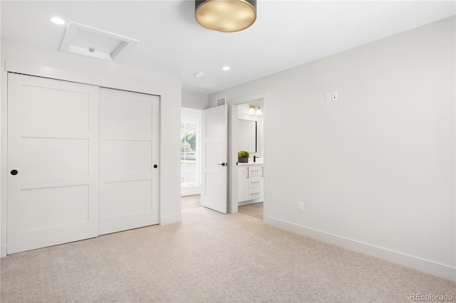 5070 Easley Rd, Golden, CO 80403 - unfurnished bedroom featuring attic access, light carpet, a closet, ensuite bathroom, and recessed lighting