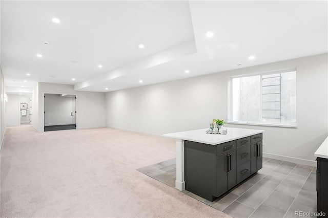 5070 Easley Rd, Golden, CO 80403 - kitchen with a kitchen island, light countertops, recessed lighting, open floor plan, and dark cabinetry