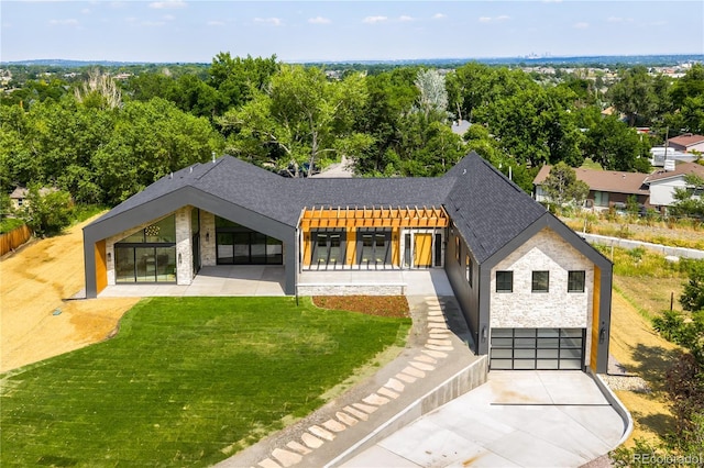 5070 Easley Rd, Golden, CO 80403 - view of front of home with stone siding, driveway, a front yard, and a shingled roof