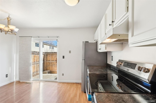kitchen with light wood-style flooring, dark countertops, baseboards, stainless steel electric stove, and under cabinet range hood