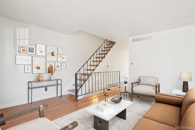 8975 Field St Unit 39, Broomfield, CO 80021 - living area featuring wood finished floors, stairs, and baseboards