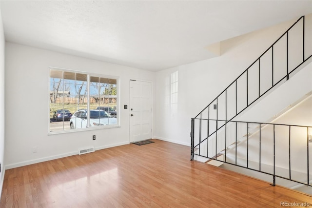 8975 Field St Unit 39, Broomfield, CO 80021 - entryway with wood finished floors, baseboards, and stairway