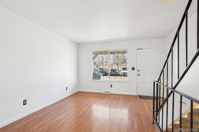 8975 Field St Unit 39, Broomfield, CO 80021 - foyer entrance featuring stairs, light wood finished floors, and baseboards