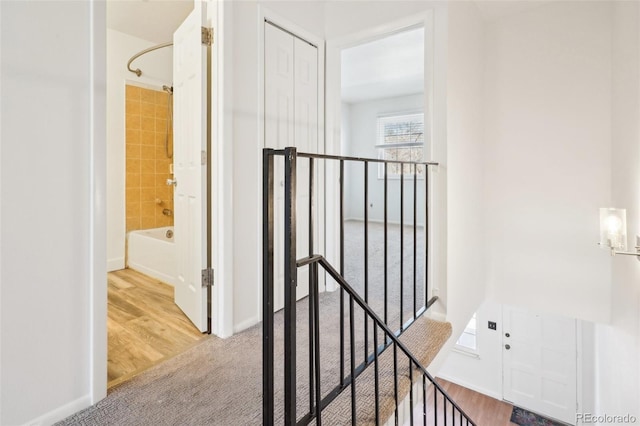 8975 Field St Unit 39, Broomfield, CO 80021 - hall featuring an upstairs landing, carpet floors, and baseboards