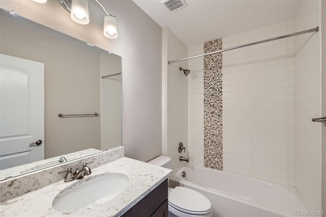 8661 Hunters Hill Ln, Littleton, CO 80125 - bathroom featuring toilet, vanity, tub / shower combination, and a textured wall