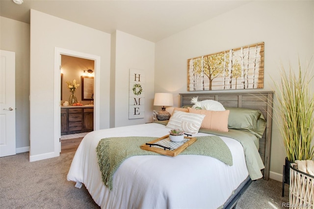 carpeted bedroom with ensuite bathroom