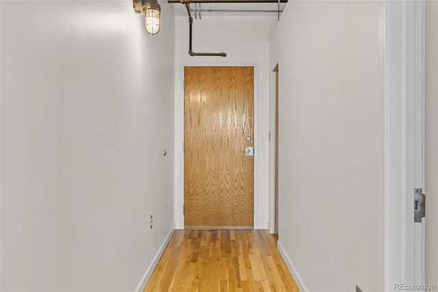 2020 Arapahoe St Unit 970, Denver, CO 80205 - hallway with light wood-style flooring and baseboards