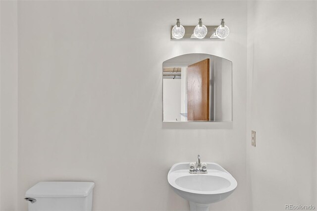 2020 Arapahoe St Unit 970, Denver, CO 80205 - half bath with a sink and toilet